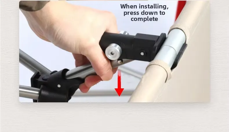 Installation step press down lever buckle to assemble folding camp cot